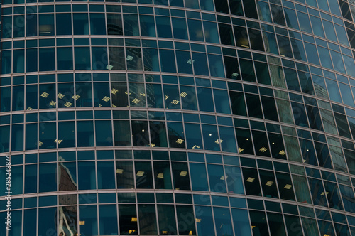 blue glass windows of modern office building