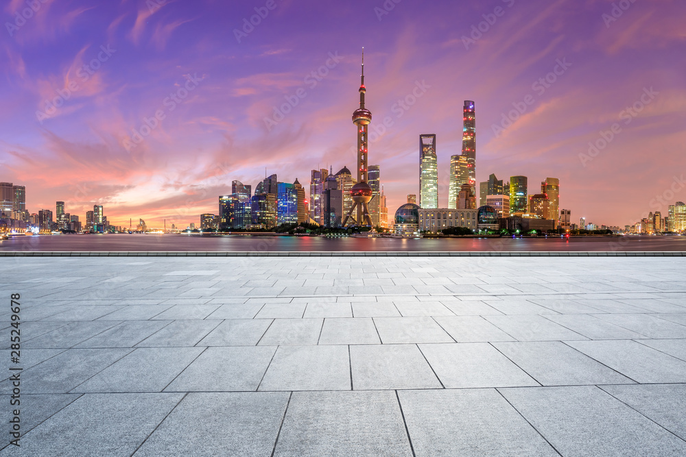 Shanghai skyline and modern buildings with empty square floor at sunrise,China.