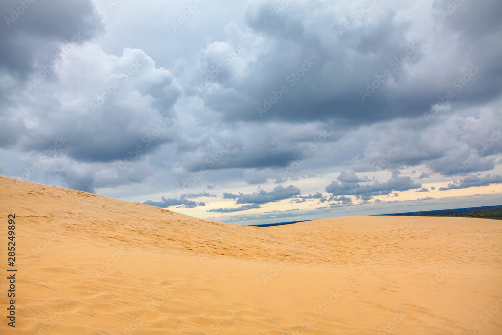 landscape with low clouds over the sandy duna