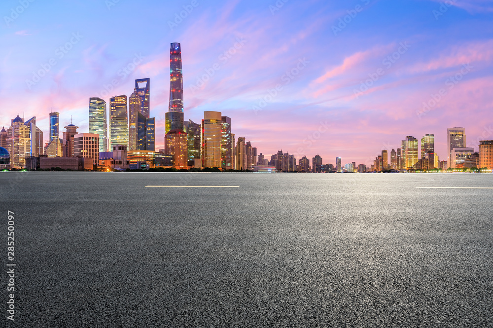 Shanghai skyline and modern buildings with empty asphalt highway at sunrise,China Shanghai skyline and modern buildings with empty asphalt highway at sunrise,China