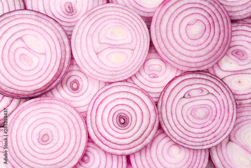 Onion slices as a background. Top view. Onion slices as a background. Top view.