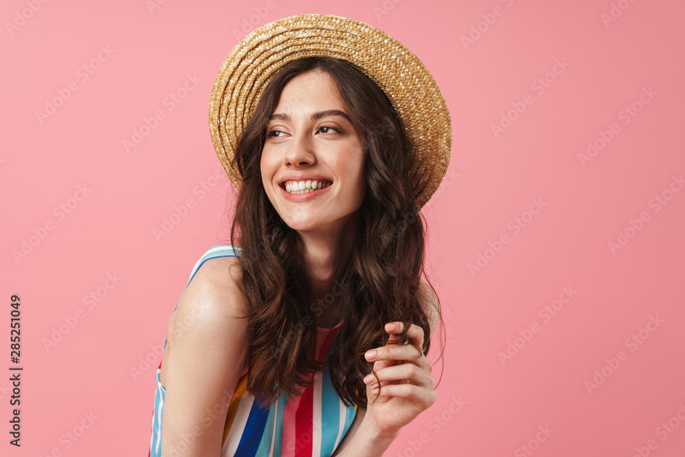 Happy positive smiling cute woman posing isolated over pink wall background Happy positive smiling cute woman posing isolated over pink wall background
