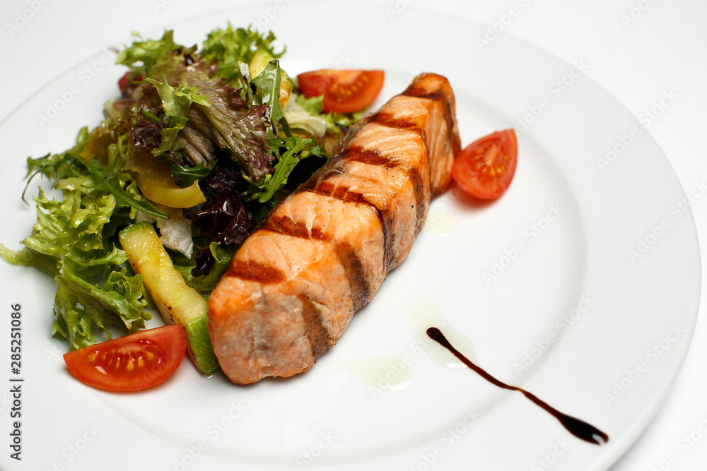 grilled salmon steak with vegetable salad