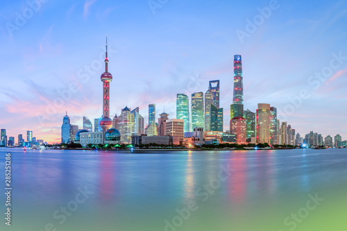 Shanghai skyline and modern urban buildings at sunrise panoramic view.