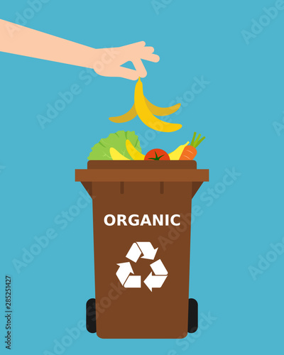 Hand throwing a banana peel into a recycle bin. Recycling organic waste, compost, segregate waste, sorting garbage, eco friendly, concept. Blue background. Vector illustration, flat style.