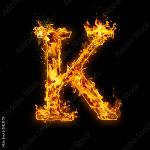 Letter K. Fire flames on black isolated background, realistick fire effect with sparks. Part of alphabet set
