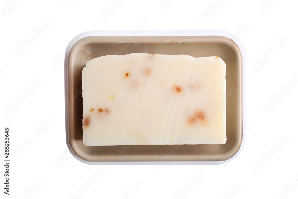 Natural organic soap without packaging in a soap dish isolated on white. Natural organic soap without packaging in a soap dish isolated on white.