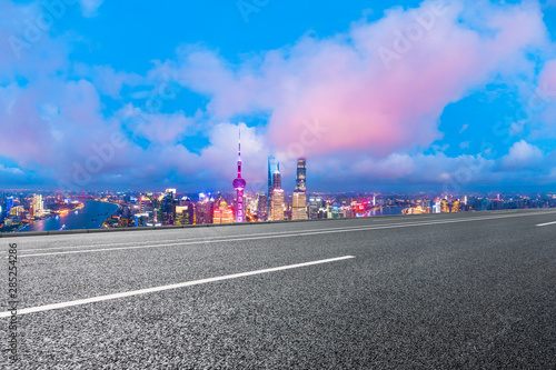 Shanghai skyline and modern buildings with empty highway at night,high angle view