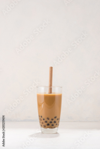 Chocolate Bubble Tea glasses with drink straw on white background.