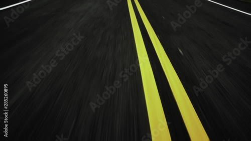 Front pov view of fast car driving on asphalt road photo