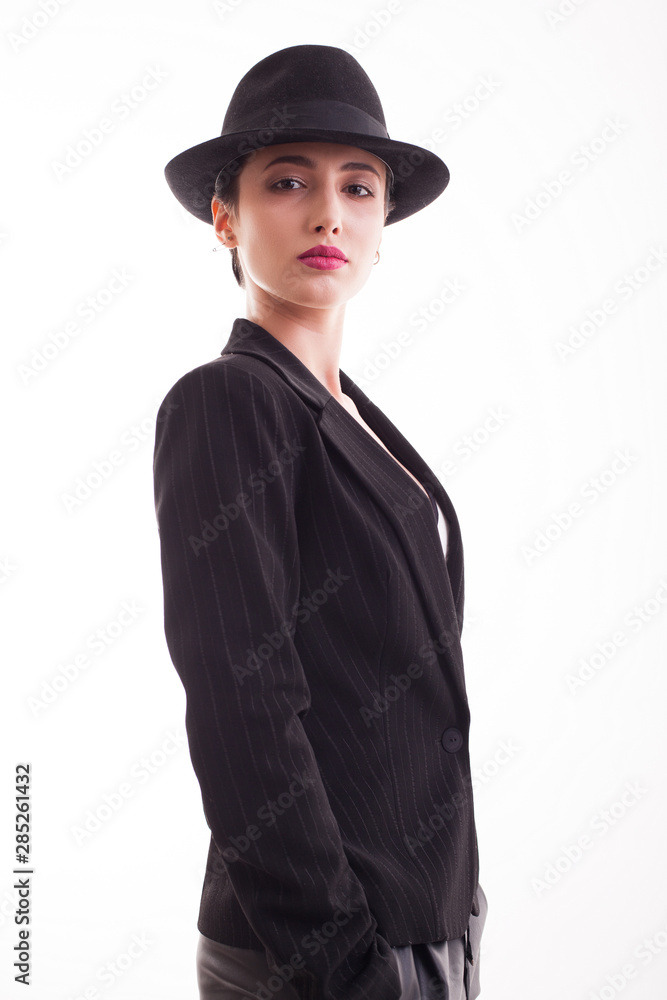 Caucasian beauty posing in studio posing wiht confidence in front of the camera over white background Caucasian beauty posing in studio posing wiht confidence in front of the camera over white background