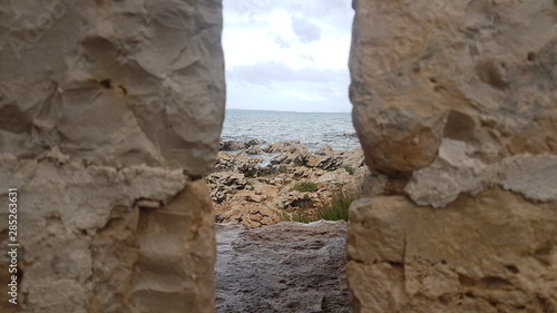 looking through to the gap to the sea and rocks