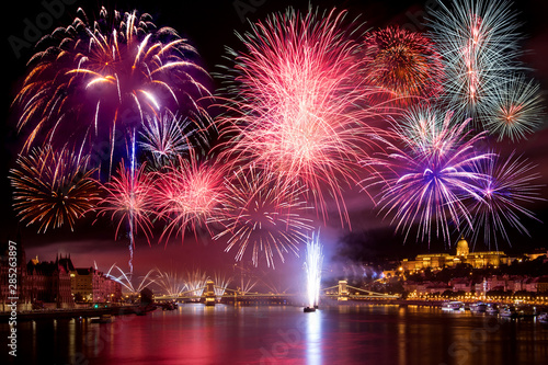Colorful fireworks in Budapest august 20. at night - Buda Castle, Chain bridge, Danube and parliament in the background