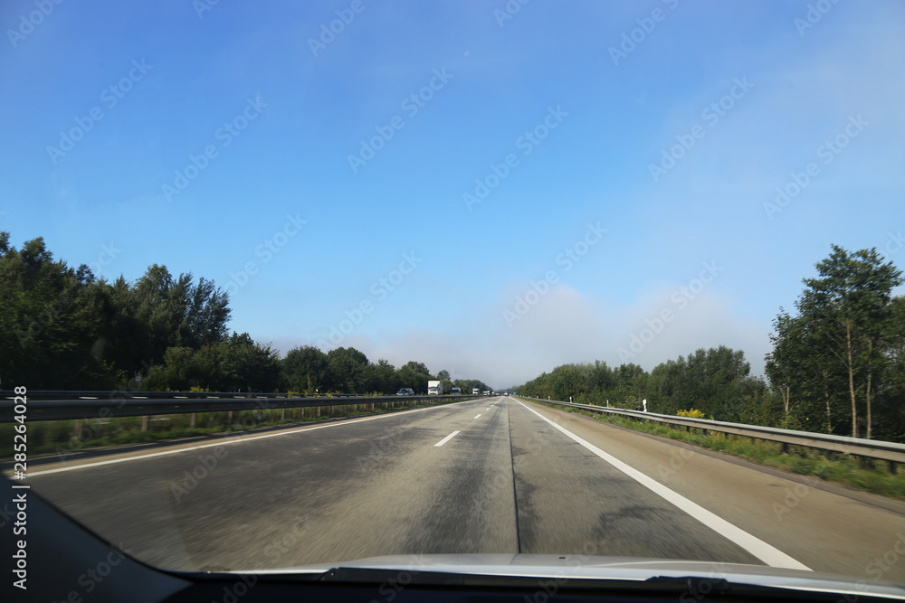 On the highway, photographed from inside the car On the highway, photographed from inside the car