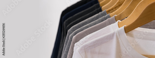 Obraz na płótnie Close up of T-shirts on hangers, apparel background