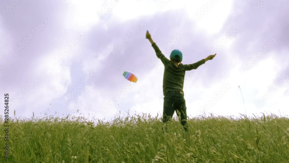 A boy flying in blue sky with some clouds. A boy flying in blue sky with some clouds.
