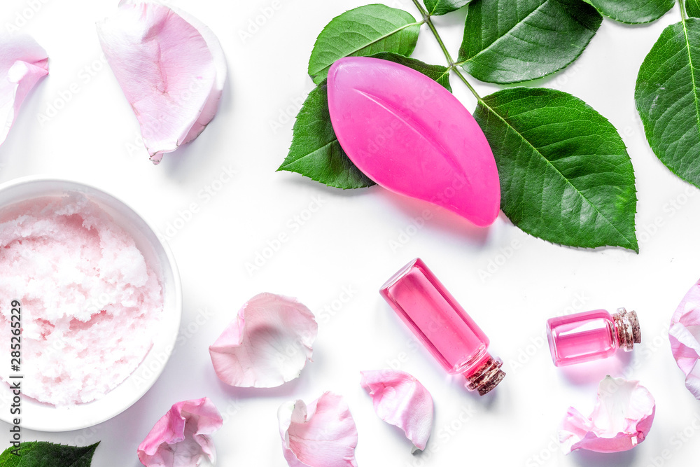 organic cosmetic with rose oil on white background top view organic cosmetic with rose oil on white background top view