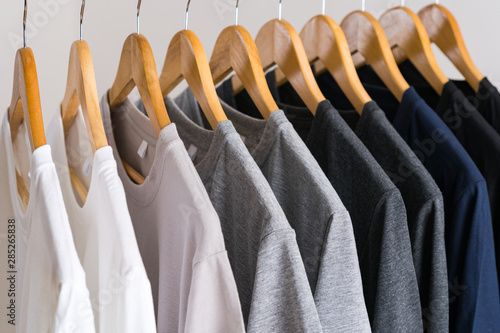 Close up of T-shirts on hangers, apparel background photo