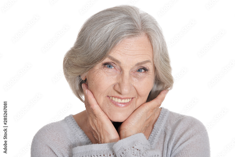 Beautiful senior woman, posing against white background Beautiful senior woman, posing against white background