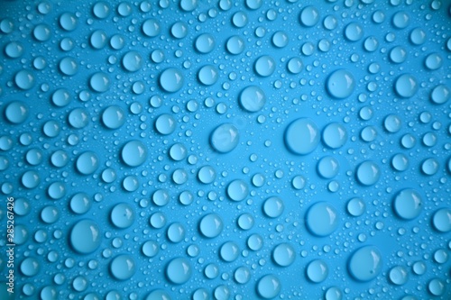 drops water on blue texture background