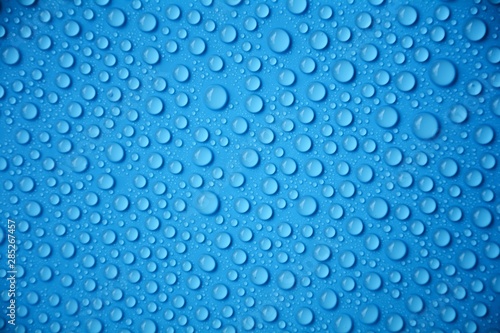 drops water on blue texture background
