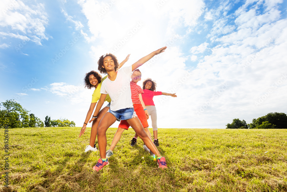 Group of boy and girls smile bending with hands Group of boy and girls smile bending with hands