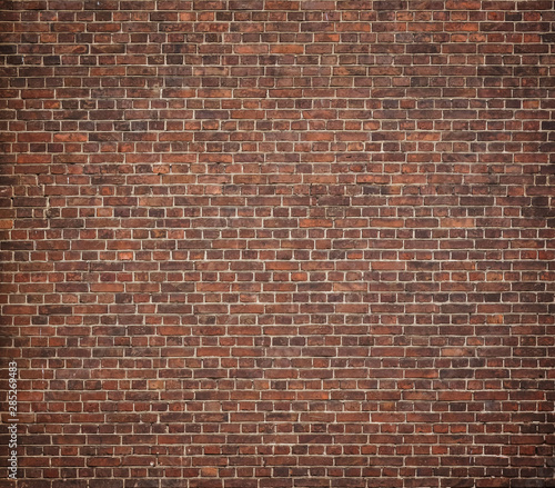 Full frame image of the old red brick wal. High resolution texture with vignetted corners for background, poster, collage in the urban loft or grunge style
