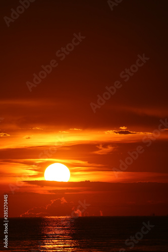 sun dawn back on morning sky silhouette cloud on sea © darkfoxelixir