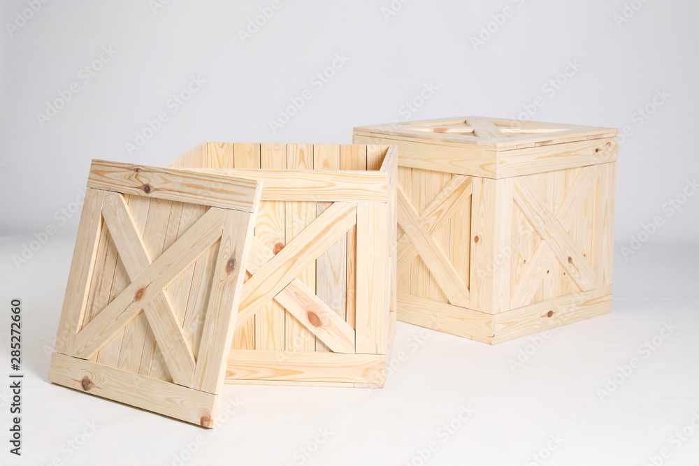 Pair of wooden crates on grey background Pair of wooden crates on grey background