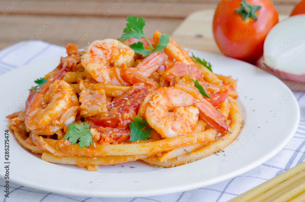 Macaroni, shrimp & bacon  with tomato sauce.