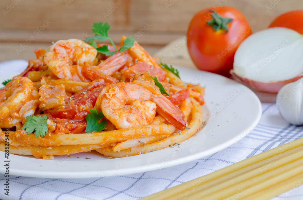 Macaroni, shrimp & bacon  with tomato sauce.