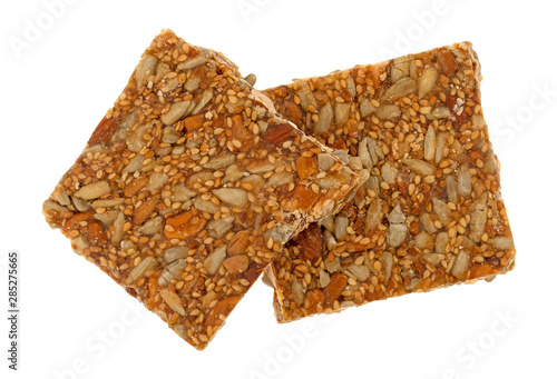 Pieces of honey nut crunch candy on a white background