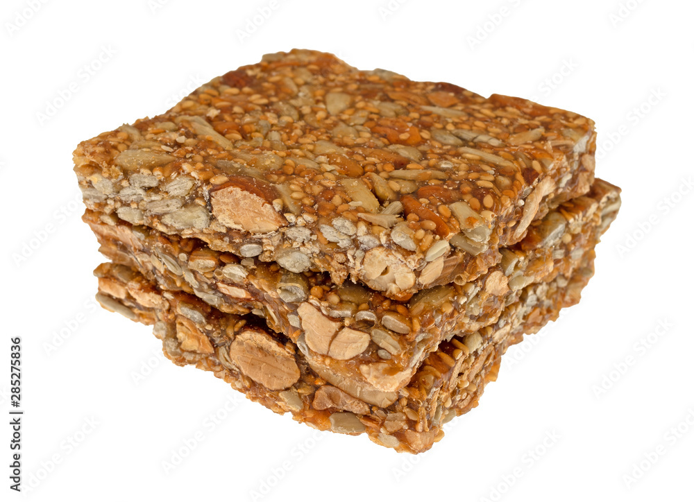 Three pieces of honey nut crunch candy on a white background Three pieces of honey nut crunch candy on a white background