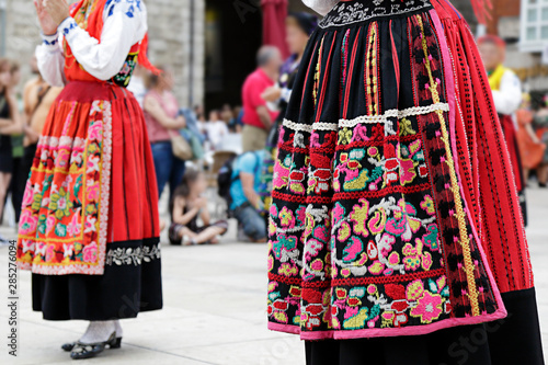 Fototapeta Woman dancing and wearing one of the traditional folk costume from Portugal