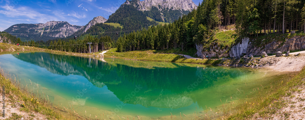 High resolution stitched panorama of a beautiful alpine view with reflections in a lake at the famous Jenner summit near Berchtesgaden, Bavaria, Germany