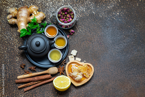 Tea, Cup of tea, dried tea leaves with tea pot and herb, honey,ginger on grunge dirty background