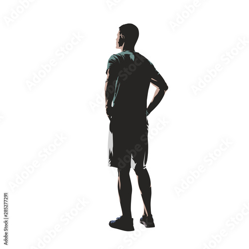 Young man dressed in t-shirt and shorts standing with hands on hips, back view. Flat design isolated vector illustration