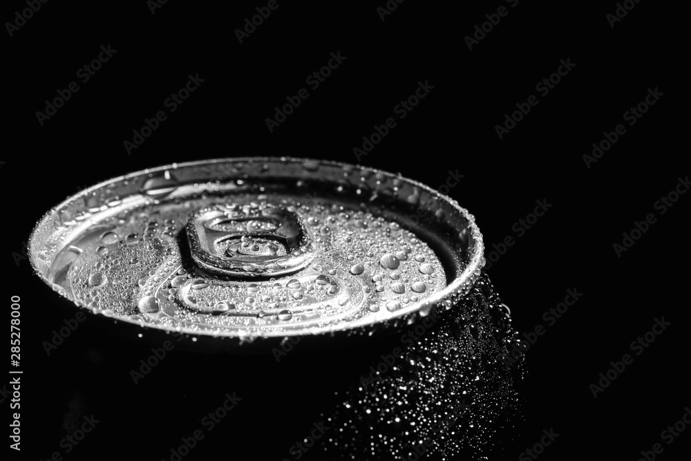 Aluminum can of beverage covered with water drops on black background, closeup Aluminum can of beverage covered with water drops on black background, closeup