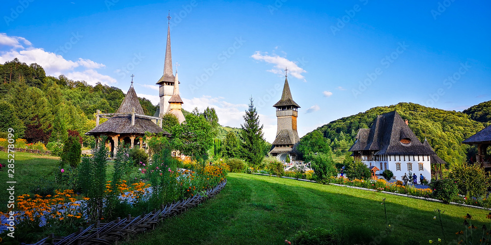 BARSANA MONASTERY - AUGUST 16. Unidentified tourists visiting Barsana monastery on August 16, 2019. Maramures area, Romania BARSANA MONASTERY - AUGUST 16. Unidentified tourists visiting Barsana monastery on August 16, 2019. Maramures area, Romania