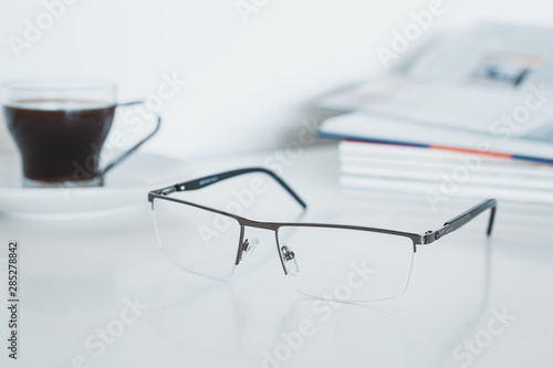 Glasses with book and coffee