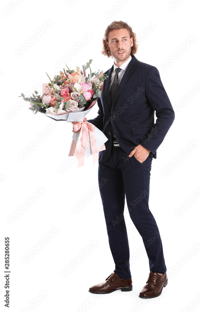 Young handsome man in stylish suit with beautiful flower bouquet on white background Young handsome man in stylish suit with beautiful flower bouquet on white background