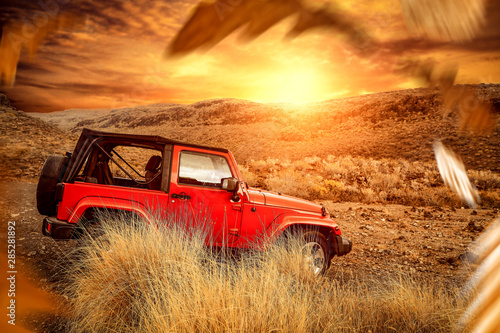 Golden sunset time and free space for your decoration. Autumn car trip and mountains landscape 
