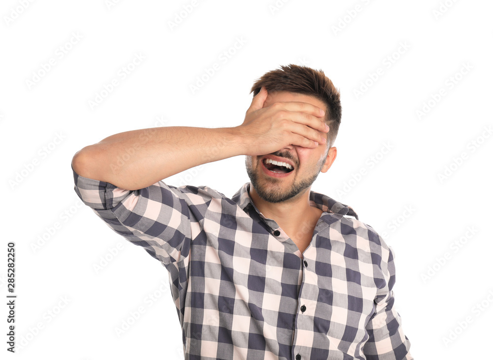Young man being blinded on white background Young man being blinded on white background
