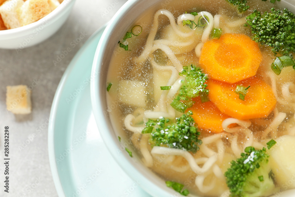 Bowl of fresh homemade vegetable soup on table, closeup Bowl of fresh homemade vegetable soup on table, closeup