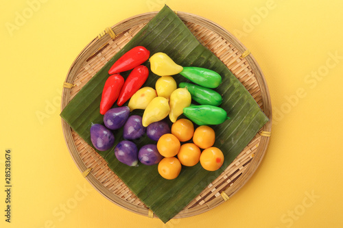 Colourful Luk chup look choop tadeonal Thai desert sweets candy creatve variety bamboo plate banana leaf photo