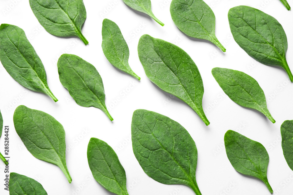 Fresh green healthy spinach leaves on white background, top view
