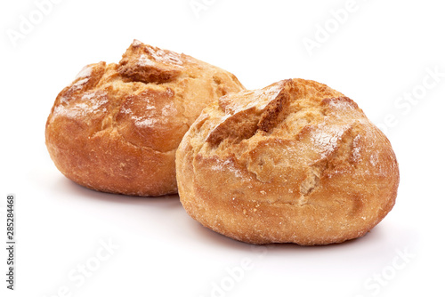 Freshly baked round bread loaf, isolated on white background