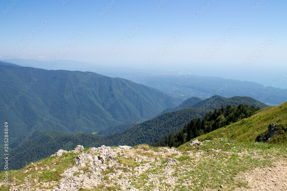 Summer landscape in the mountains and dark blue sky with clouds