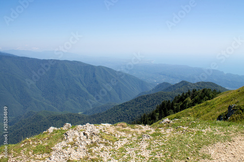 Summer landscape in the mountains and dark blue sky with clouds