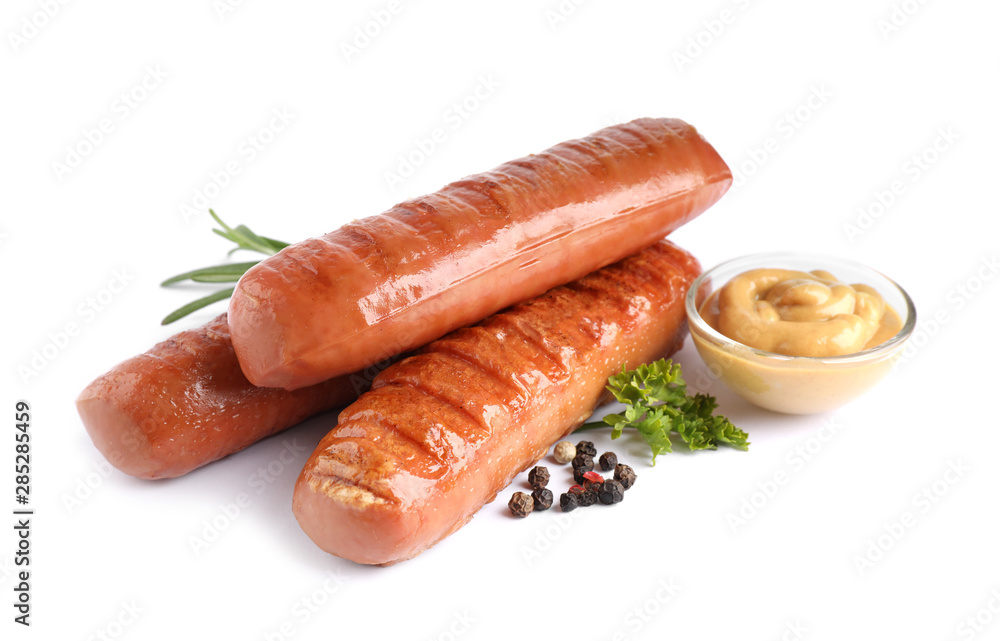 Delicious grilled sausages and sauce on white background. Barbecue food Delicious grilled sausages and sauce on white background. Barbecue food